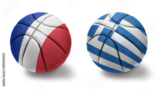 basketball balls with the national flags of greece and france on the white background. photo