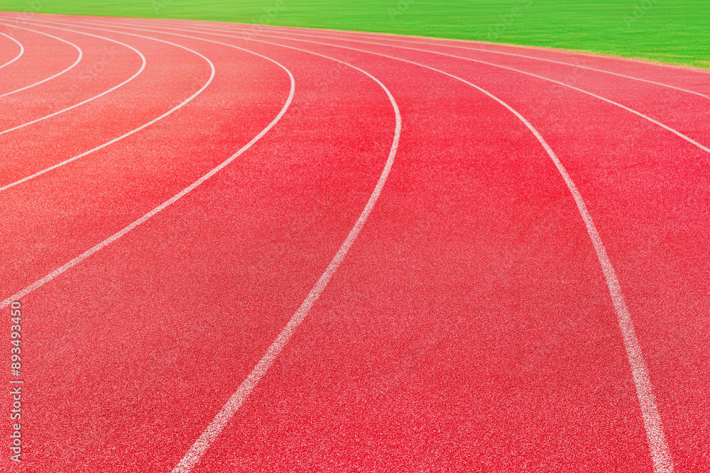 Fototapeta premium red running track at stadium - sport background