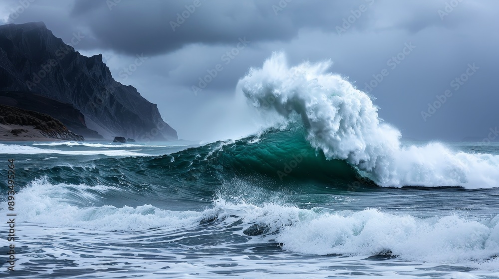 A large wave is crashing on the shore, with a mountain in the background A large wave is crashing on the shore, with a mountain in the background