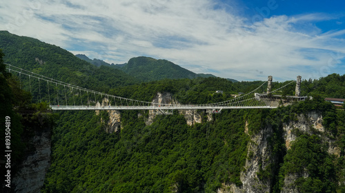 Glass bridge of Zhangjiajie China Tianzishan with blue sky, Zhangjiajie national forest park, China, concept of world heritage, avatar, heritage peak or cliff mountain, tourist attraction famous place