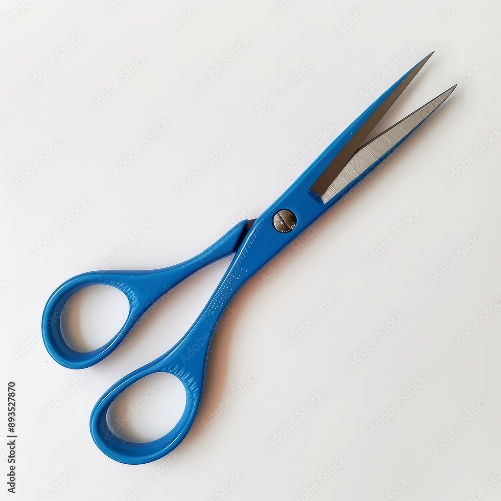 A pair of blue scissors on a white background A pair of blue scissors on a white background