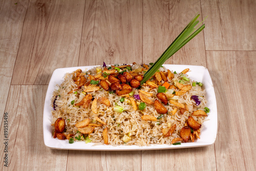 Close up of Burnt Garlic Vegetable Fried Rice in a white ceramic plate.