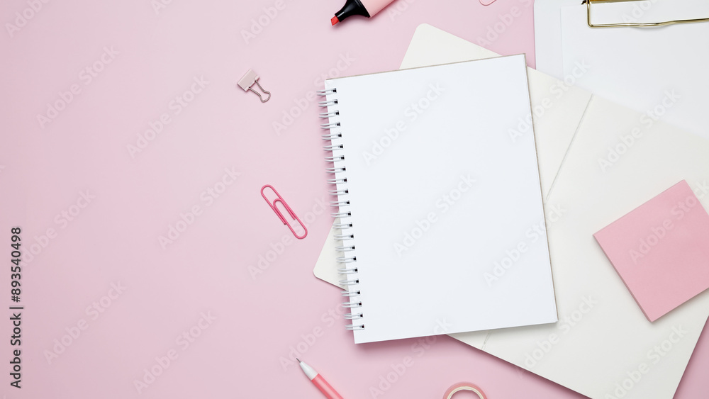Creative flat lay mockup design of workspace. Top view composition with white notebook, to do list and stationery on pink background Creative flat lay mockup design of workspace. Top view composition with white notebook, to do list and stationery on pink background