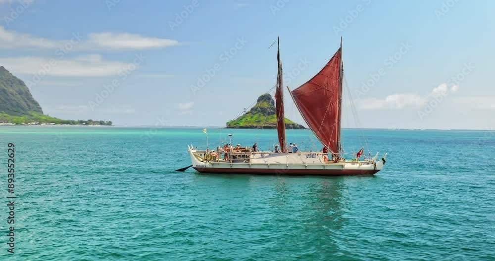 Fast drone shot around beautiful boats in Hawaiian ocean - wide, arc Fast drone shot around beautiful boats in Hawaiian ocean - wide, arc