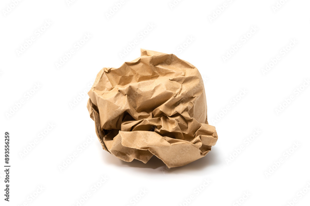 Crumpled paper ball isolated on a white background. Battered brown paper Crumpled paper ball isolated on a white background. Battered brown paper