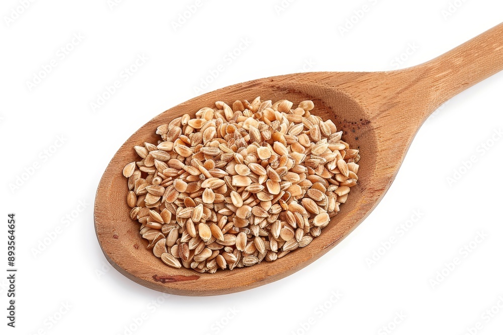 Top view of organic peeled spelt grains in a wooden spoon, isolated on white Top view of organic peeled spelt grains in a wooden spoon, isolated on white