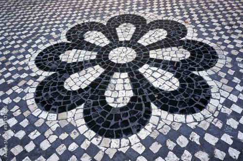 Pattern in Flower Shape in Mosaic Paving Tiles in Sintra, Portugal.