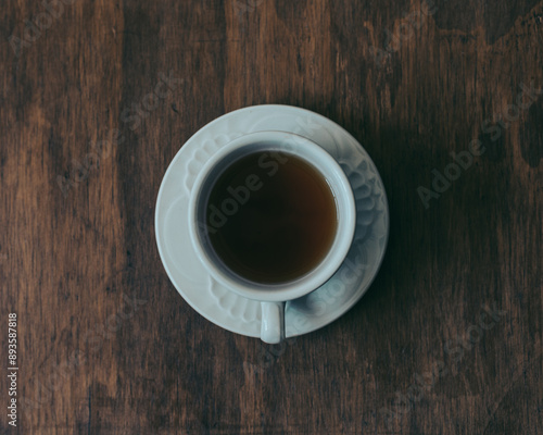 cup of coffee on wooden table