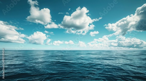 A breathtaking view of the sea horizon under a clear blue sky with white clouds, showcasing a serene and expansive landscape