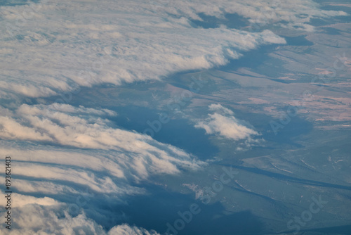 Views of clouds and clearings from a plane Madrid - Paris