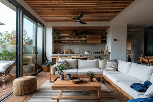 A modern living room featuring a wooden ceiling, sliding glass doors that open to an outdoor area, and a mix of comfortable and chic furniture pieces, creating a stylish space.