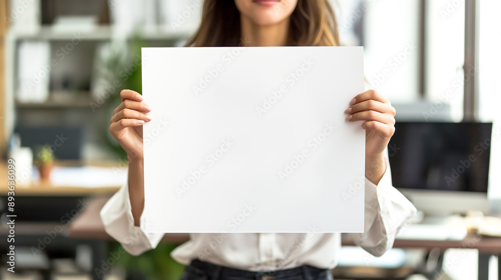 women holds a white sign in her hands in front of herself on the blurred background of the office, person holds white empty display mock up in his hands in the office, empty white copy space mock up women holds a white sign in her hands in front of herself on the blurred background of the office, person holds white empty display mock up in his hands in the office, empty white copy space mock up