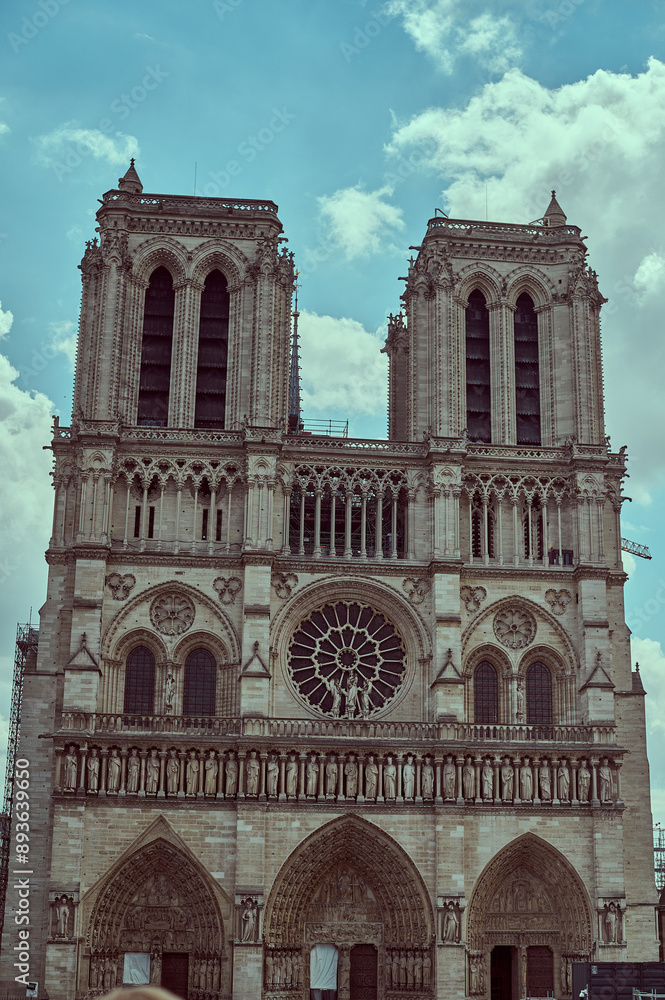 Fototapeta premium Sightseeing in Paris through Montmartre, the Latin Quarter, Notre Dame, the Eiffel Tower, the Champs Elysées, the Louvre Museum and the streets with ancient buildings, in the year of the Olympic Games