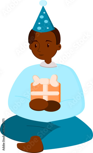 dark-skinned boy holding a birthday present