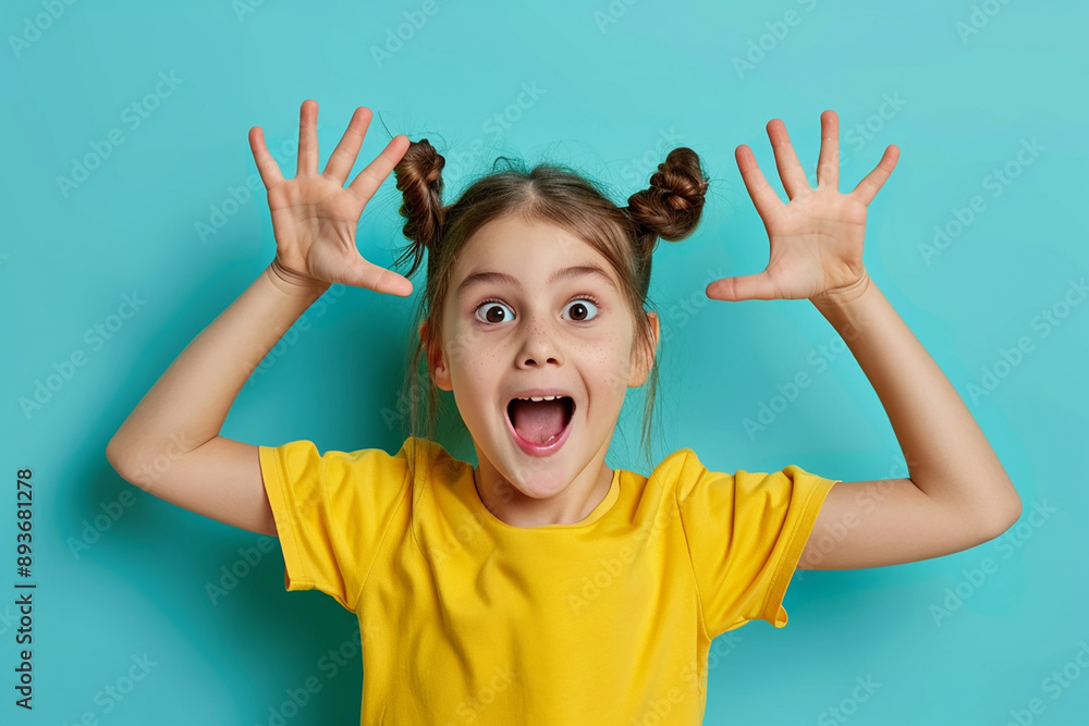 A girl in a yellow shirt making a surprised face against a blue background, with space for text on the side. A girl in a yellow shirt making a surprised face against a blue background, with space for text on the side.