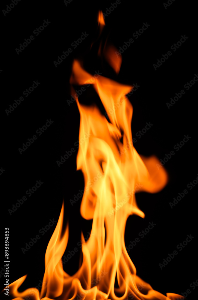 fire on a black background, burning and hot flames, close view fire on a black background, burning and hot flames, close view