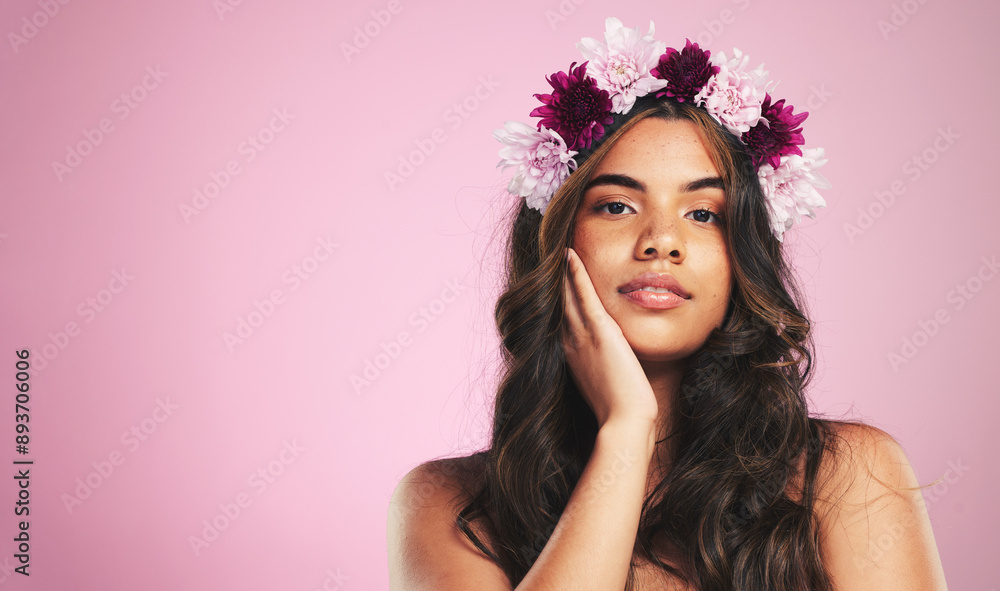 Woman, flowers and portrait with crown on pink background for natural beauty, skincare and mockup space in studio. Face, model and floral hair band for sustainability, eco dermatology and cosmetics Woman, flowers and portrait with crown on pink background for natural beauty, skincare and mockup space in studio. Face, model and floral hair band for sustainability, eco dermatology and cosmetics