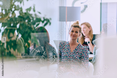 Business Team of Women Discussing New Topics and Strategies to Improve Client Operations. photo