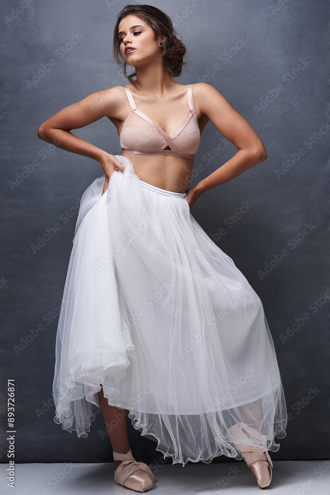 Fototapeta premium Calm woman, ballet dancer and relax with makeup, beauty or underwear for art, fashion or elegance on a wall background. Attractive female person, young model or performer in confidence, bra and skirt