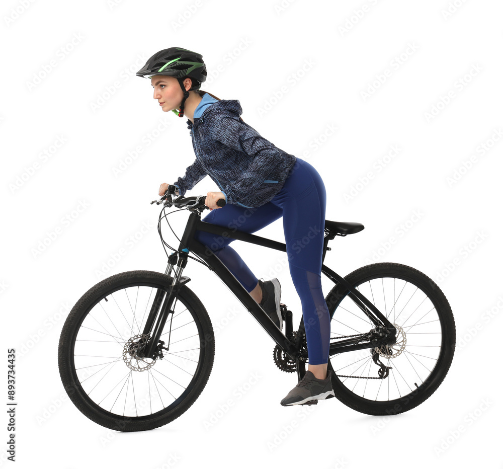 Naklejka premium Beautiful young woman in helmet riding bicycle on white background