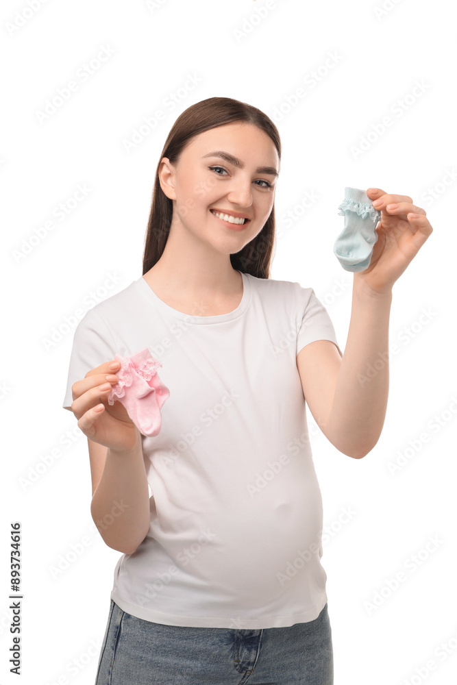 Expecting twins. Pregnant woman holding two pairs of socks on white background Expecting twins. Pregnant woman holding two pairs of socks on white background