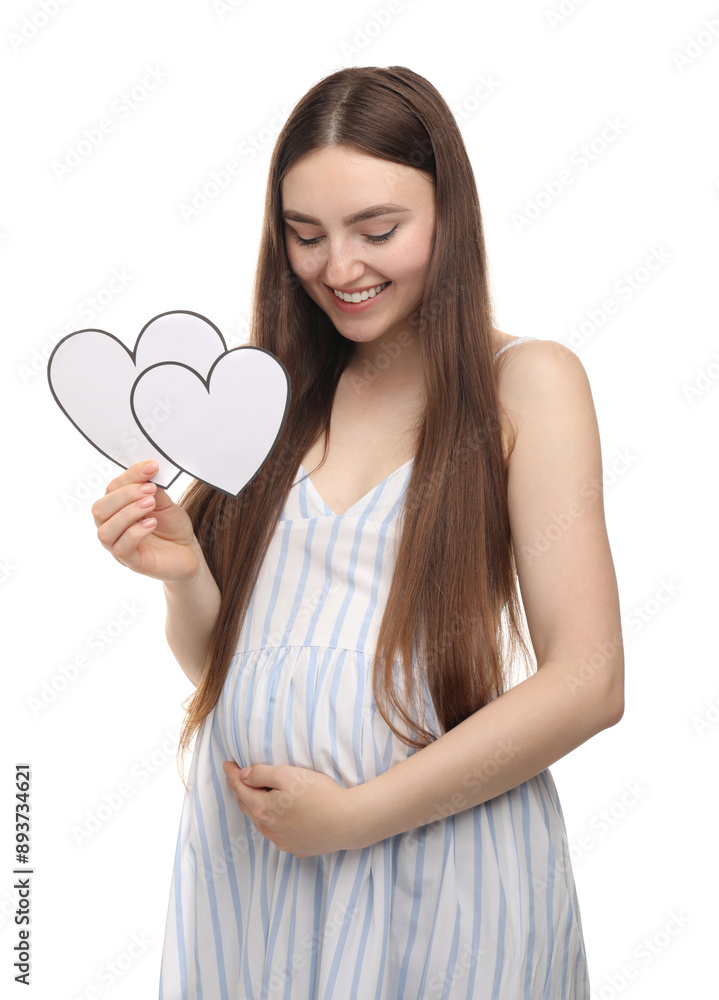 Expecting twins. Pregnant woman holding two paper cutouts of hearts on white background Expecting twins. Pregnant woman holding two paper cutouts of hearts on white background