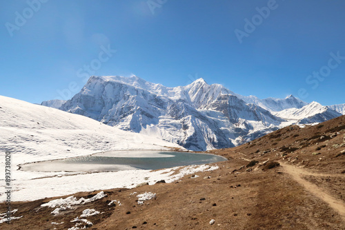 The Saano Khicho Lake in front Annapurna III, Gangapurna, Tarke Kang and Khangsar Kang, next to the Ice Lake, Kicho Tal, Khicho Ice Lake, close to Manang, Annapurna Circuit Trek, Nepal photo