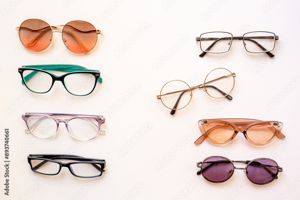 Set of glasses in optics store, top view. Eyesight and vision concept