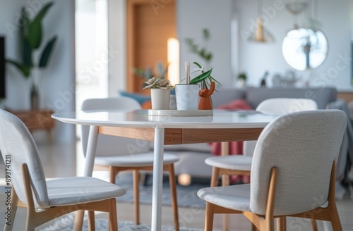 Interior of modern living room with dining table, chairs and plants