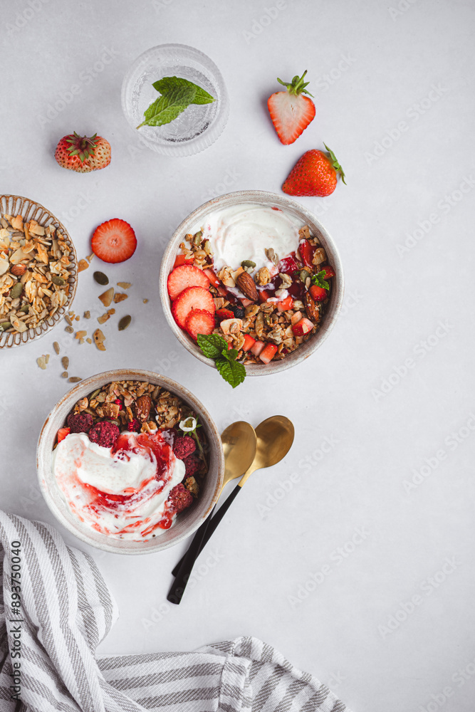Top view of summer healthy breakfast with yogurt and granola Top view of summer healthy breakfast with yogurt and granola