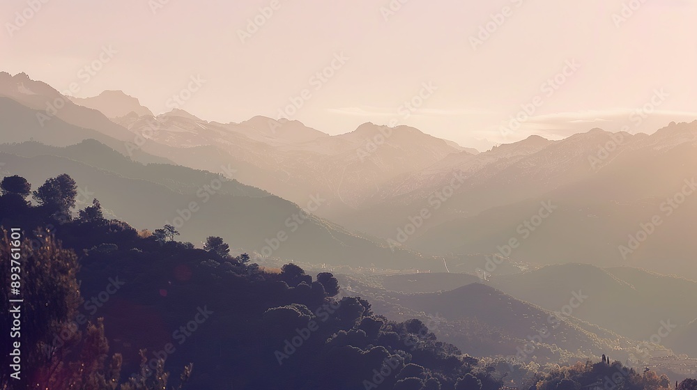 Fototapeta premium Mountain Range Silhouetted Against a Pink Sunset Sky