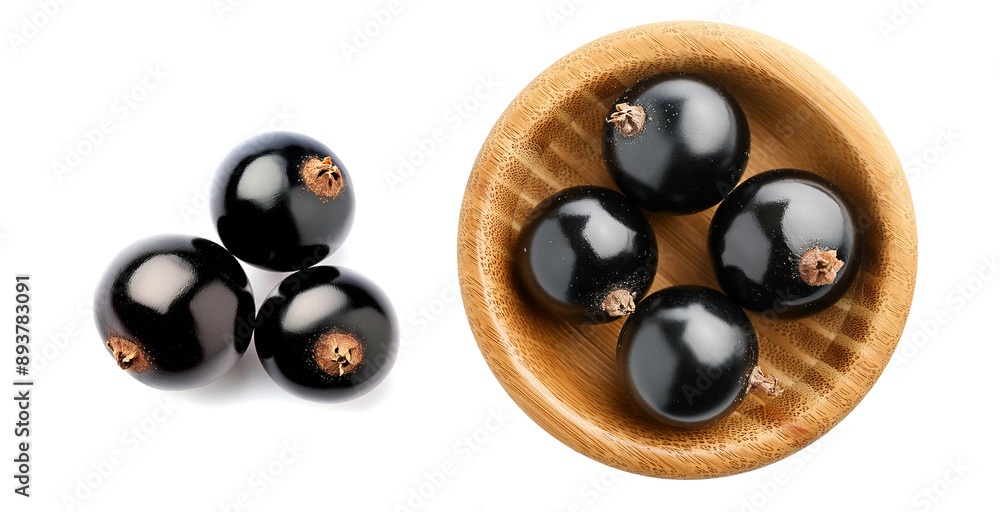 Blackcurrant fruit on a wooden tiny platter. Close-up on the detail. Vegan food. Blackcurrant fruit on a wooden tiny platter. Close-up on the detail. Vegan food.