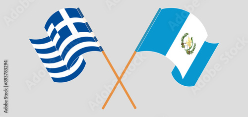 Crossed and waving flags of Greece and Republic of Guatemala