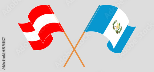 Crossed and waving flags of Austria and Republic of Guatemala