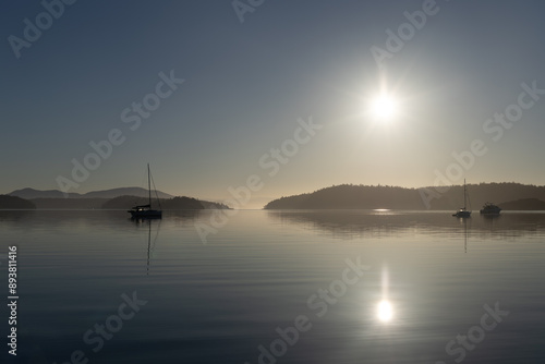 Boats sit quietly in the morning at an anchorage in Hunter Bay on Lopez Island in Washington State's San Juan Islands