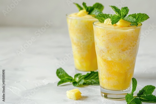 Refreshing Pineapple Smoothie with Mint Garnish