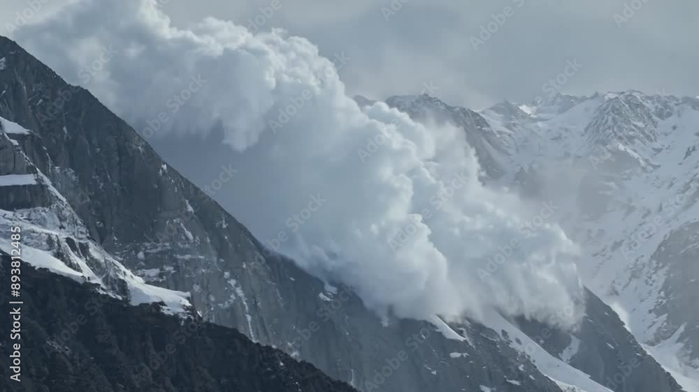 This Avalanche cascading down a snowy mountain, a breathtaking display of nature's power and beauty.