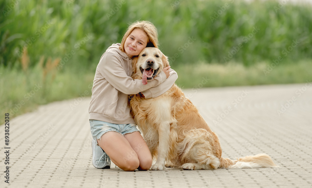 Girl Sits With Golden Retriever On Morning Walk Girl Sits With Golden Retriever On Morning Walk