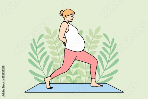 Pregnant woman does yoga on fitness mat, taking care of health of herself and unborn child. Pregnant girl is preparing to become mother by practicing yoga and pilates to support immune system.