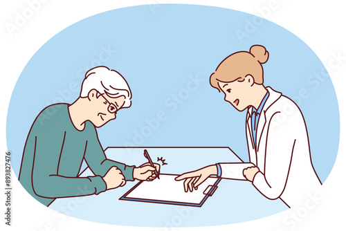 Elderly man sits near doctor filling out questionnaire for insurance for treatment of chronic diseases. Elderly man signing contract with hospital employee for advice or medical care