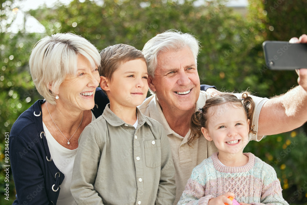 Fototapeta premium Grandparents, children and smile for outdoor selfie with love, bonding and blog update in garden. Grandma, grandpa and happy kids with picture together for social media, memory and online photo album