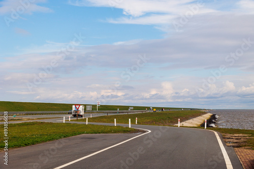 rest area on the Afsluitdijk between IJsselmeer and Wadden Sea in front of an offshore wind farm, Netherlands, Breezanddijk, 29/03/2024 photo