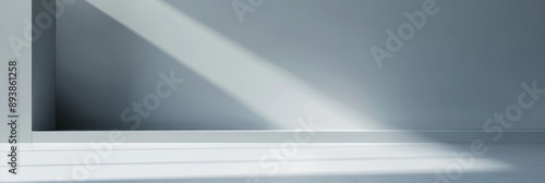 Wallpaper Mural A clean, minimal gray gradient background with a single beam of sunlight casting a shadow on the floor Torontodigital.ca