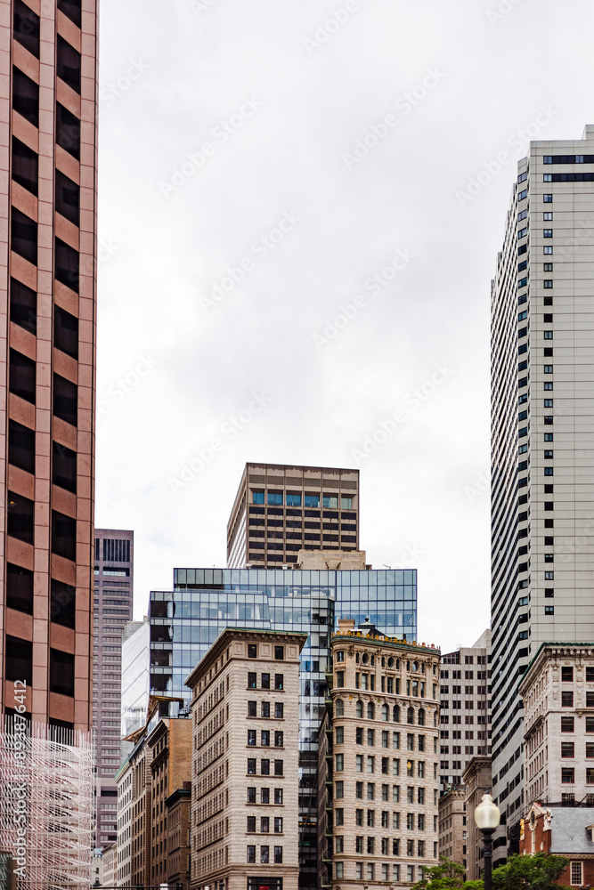 Fototapeta premium cityscape of old and new buildings in overcast day