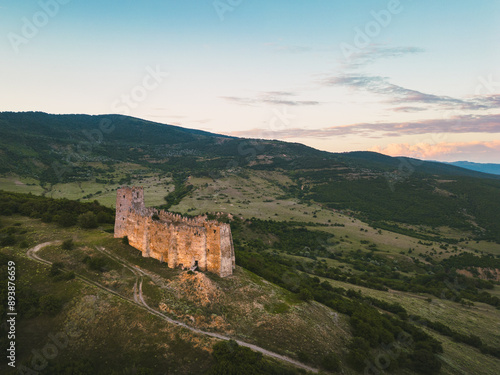 Aerial approaching view The Skhvilo fortress or Skhvilo castle. Medieval fortress in region of Shida Kartli, in Kaspi District, Georgia. 14th century. Served as residence of the duke family Amilakhor