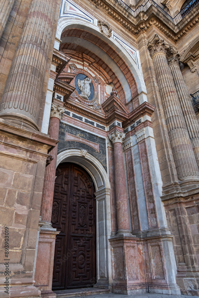 Fototapeta premium Architectural details of entrance to Malaga Cathedra. Cathedral is Roman Catholic Church (Santa Iglesia Catedral Basilica de la Encarnacion), was constructed in 1528 -1782. Malaga, Andalusia, Spain.