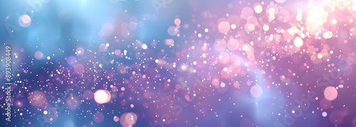 A vibrant, dreamy background featuring soft bokeh and sparkling light effects in shades of blue and purple for creative projects. 