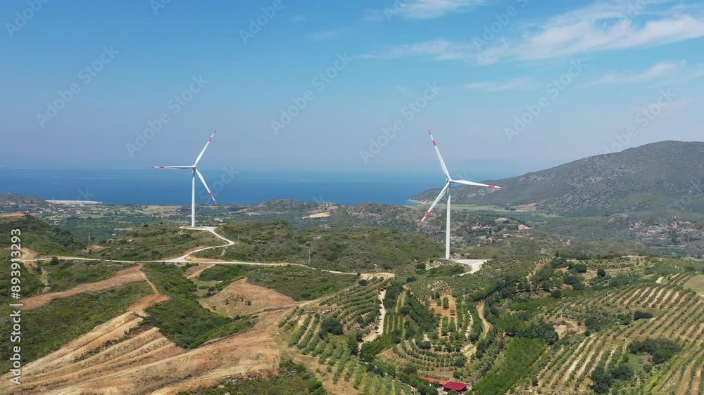 Wind energ. Spinning windmills at hills in Turkiye. Green energy production concept Wind energ. Spinning windmills at hills in Turkiye. Green energy production concept
