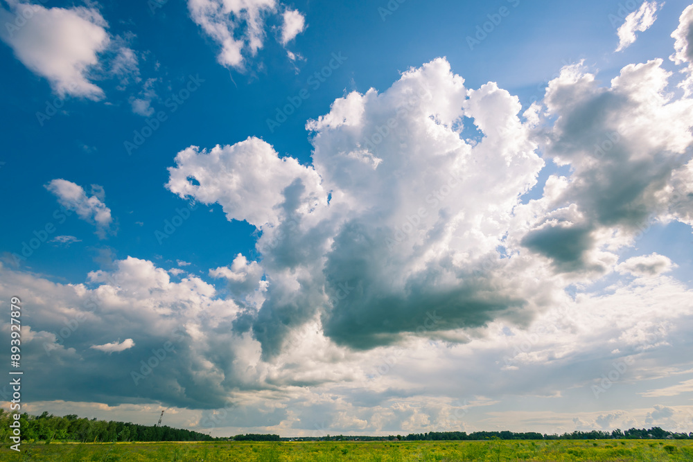A large cloud in the sky with a blue sky in the background A large cloud in the sky with a blue sky in the background