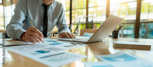 a corporate accountant reviewing the financial performance of a company, analyzing balance sheets and income statements, in a professional office setting, ideal for themes of corpo